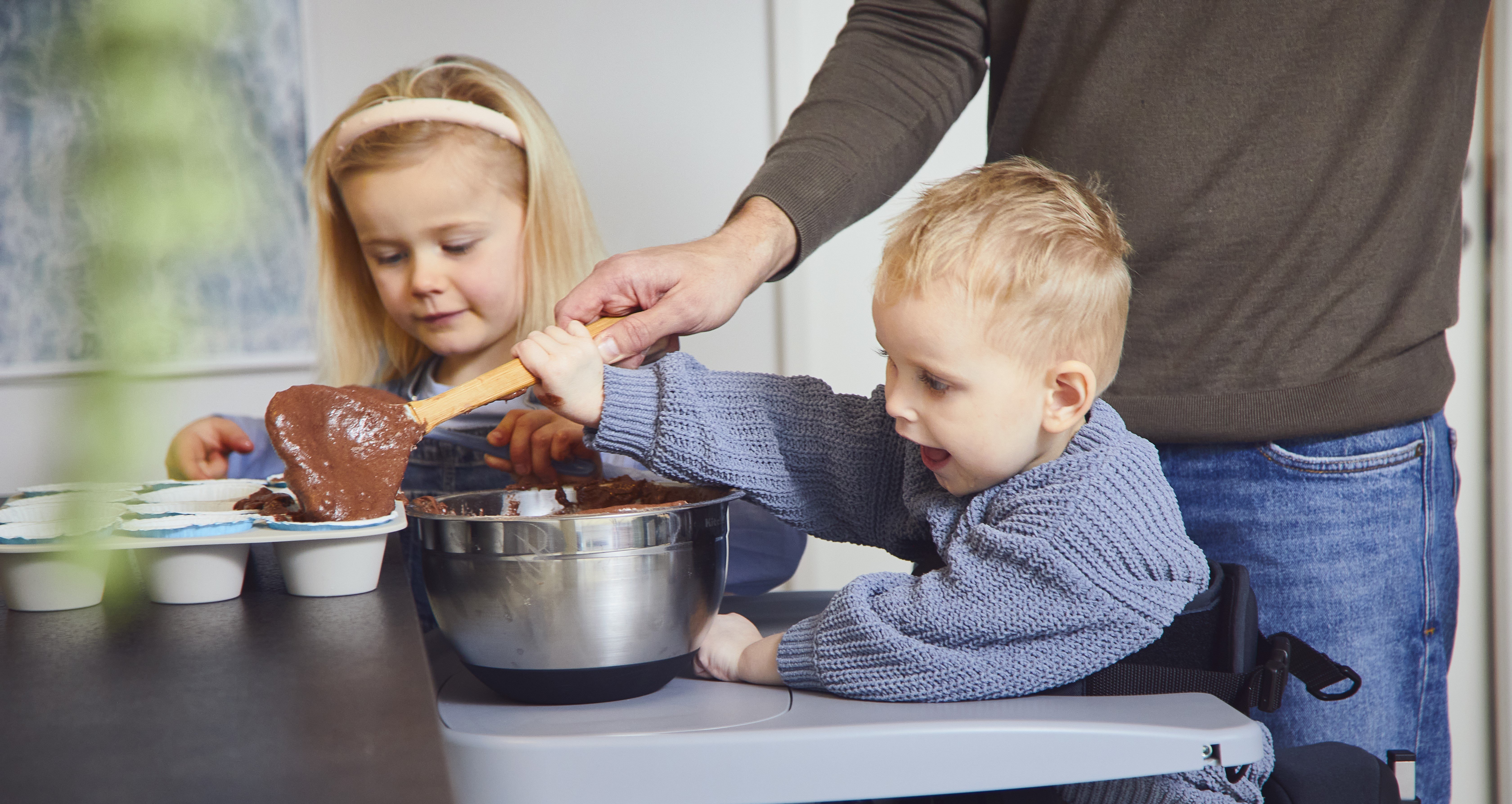 Charlie and Hannha baking in the kitchen