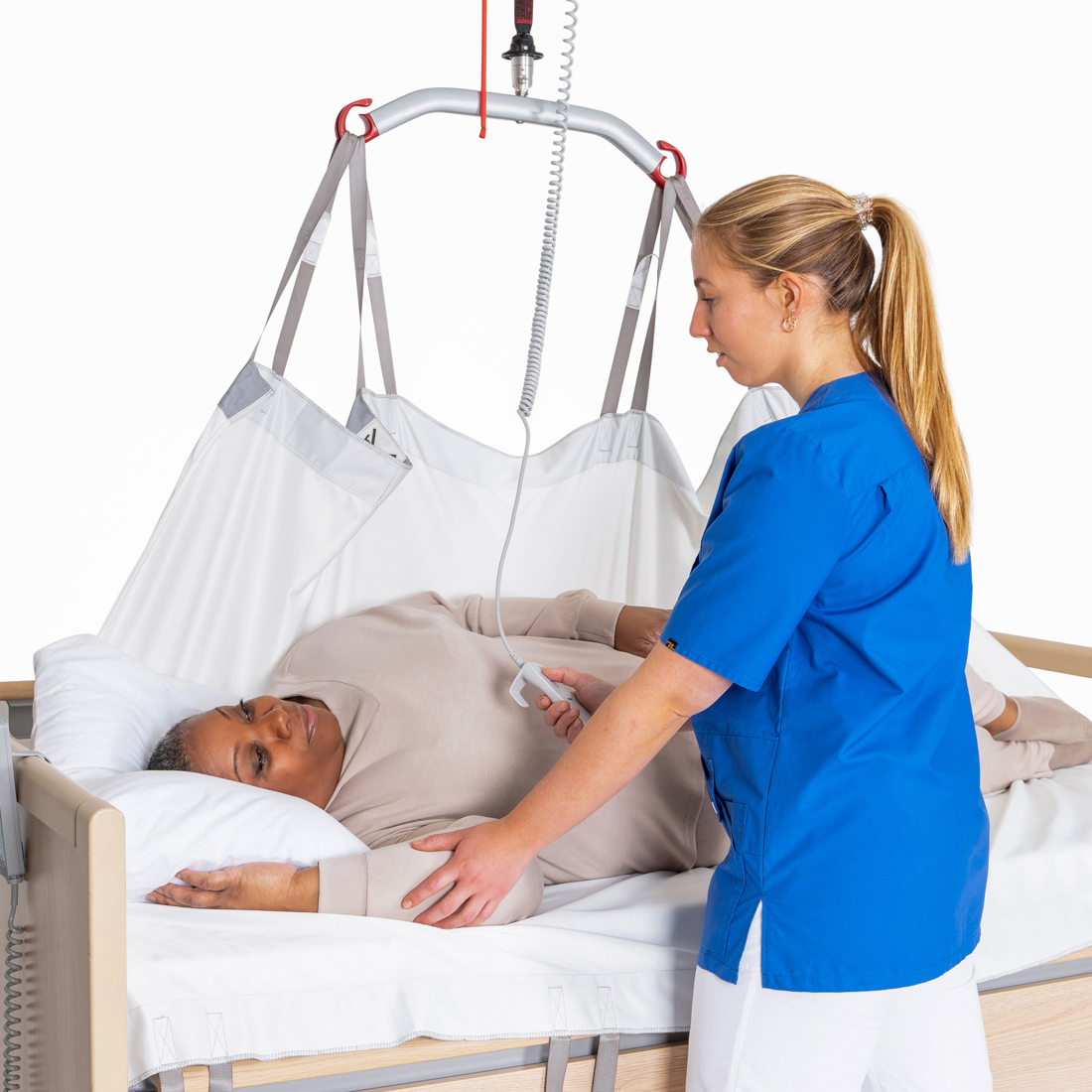 Molift UnoSling Repositioning Sheet Carer turning patient in bed.jpg