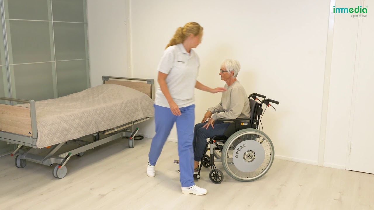 How to move a user further back in a wheelchair with assistance